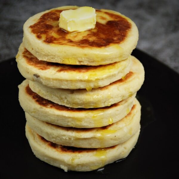 six pieces of potato cake topped with butter